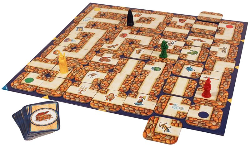 The Labyrinth board game, with four coloured player pieces, a pile of item cards and a demonstration of how the labyrinth tiles move