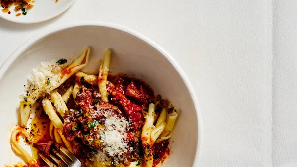 Slow-cooked lamb ragu with mint and anchovy pangrattato - slow-cooked lamb ragu