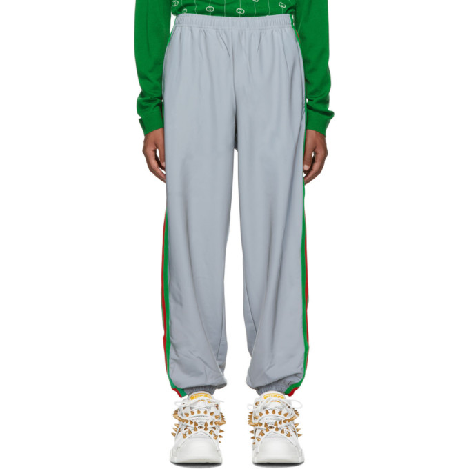 Click to view more detailed imagery on our partner's website Gucci Silver Men's Reflective Side Stripe Track Pants In 1300 Silver