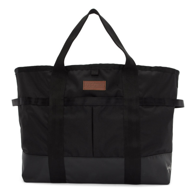 Click to view more detailed imagery on our partner's website Yohji Yamamoto Logo Embroidered Nylon Tote Bag In Black