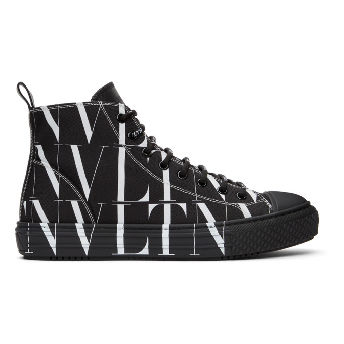 Click to view more detailed imagery on our partner's website Valentino Garavani Black And White Canvas High Top Logo Sneakers In Black/white