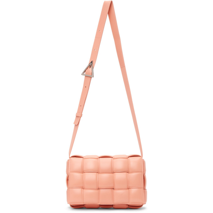 Click to view more detailed imagery on our partner's website Bottega Veneta 'cassette' Padded Intrecciato Leather Crossbody Bag In 7806 Peachy