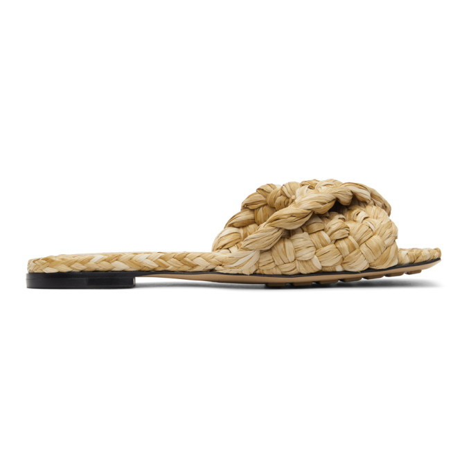 Click to view more detailed imagery on our partner's website Bottega Veneta Macadamia Raffia Stretch Flat Sandals In 2627 Macadamia