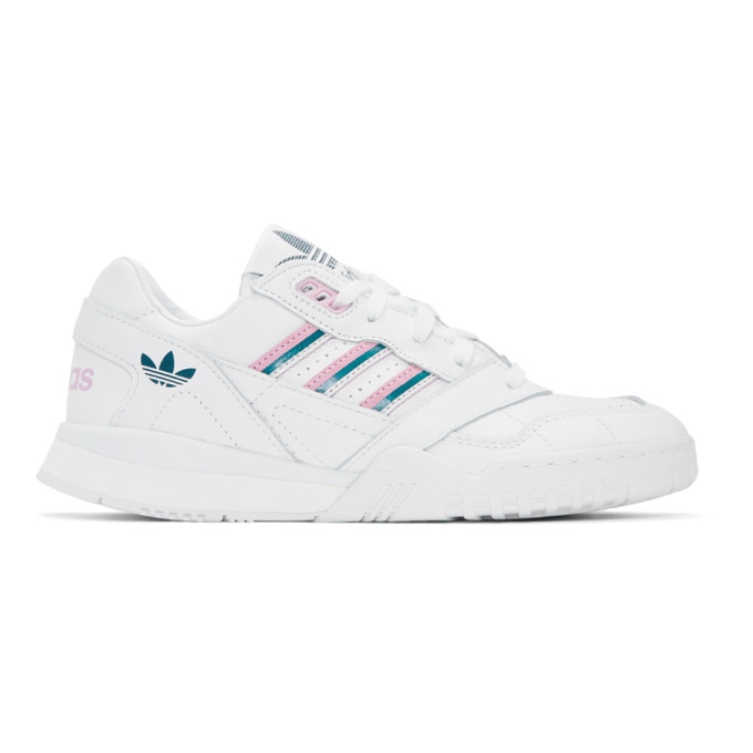 white adidas with pink stripes