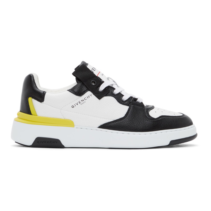 yellow sneaker with wings logo