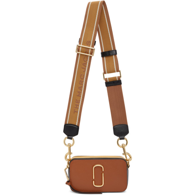 The Logo Strap Snapshot bag in brown