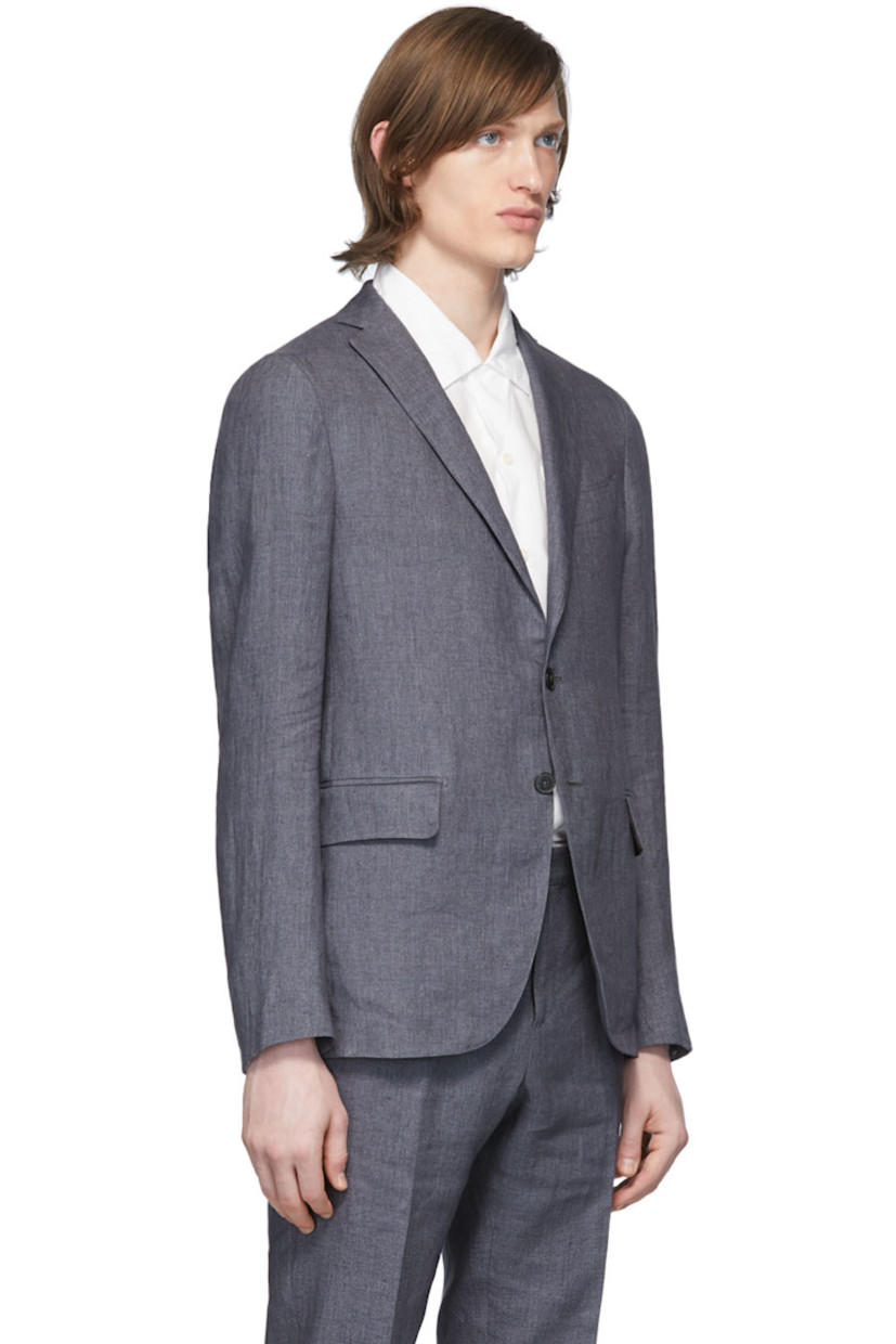 Long sleeve linen blazer in grey. Notched lapel collar. Button closure at front. Welt pocket at chest. Flap pockets at waist. Unfinished surgeon's cuffs. Twin vents at back hem. Partially lined.

Supplier color: Charcoal