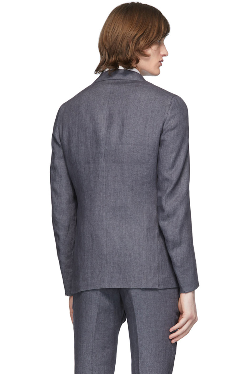 Long sleeve linen blazer in grey. Notched lapel collar. Button closure at front. Welt pocket at chest. Flap pockets at waist. Unfinished surgeon's cuffs. Twin vents at back hem. Partially lined.

Supplier color: Charcoal