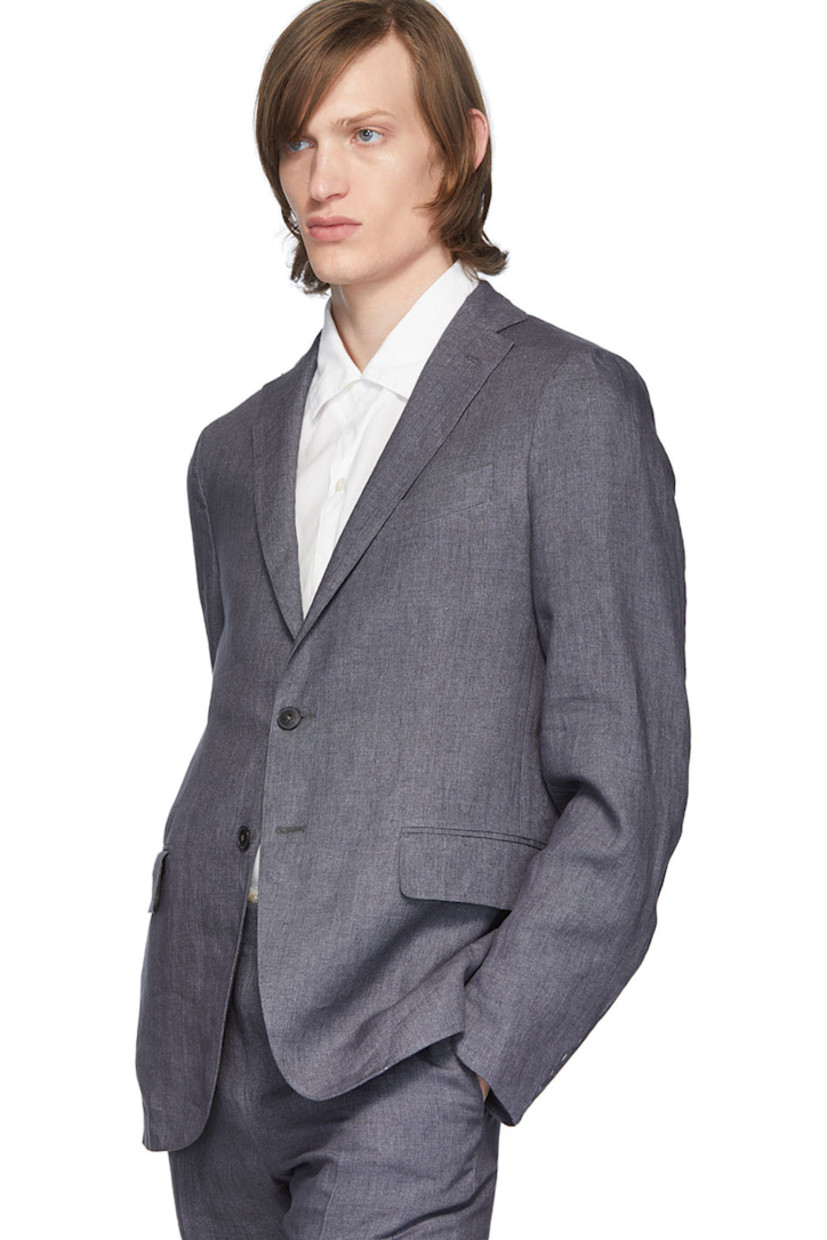 Long sleeve linen blazer in grey. Notched lapel collar. Button closure at front. Welt pocket at chest. Flap pockets at waist. Unfinished surgeon's cuffs. Twin vents at back hem. Partially lined.

Supplier color: Charcoal