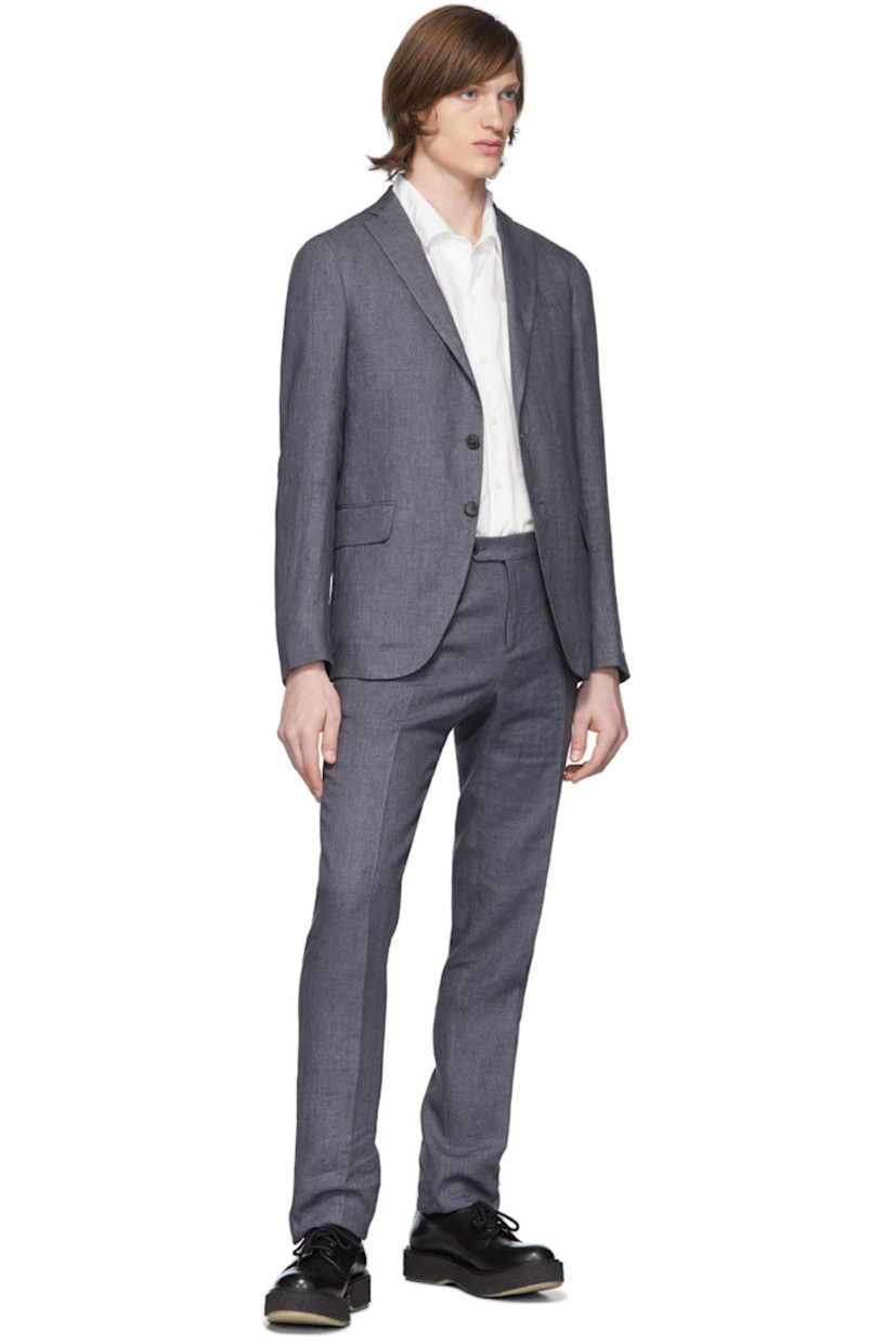 Long sleeve linen blazer in grey. Notched lapel collar. Button closure at front. Welt pocket at chest. Flap pockets at waist. Unfinished surgeon's cuffs. Twin vents at back hem. Partially lined.

Supplier color: Charcoal