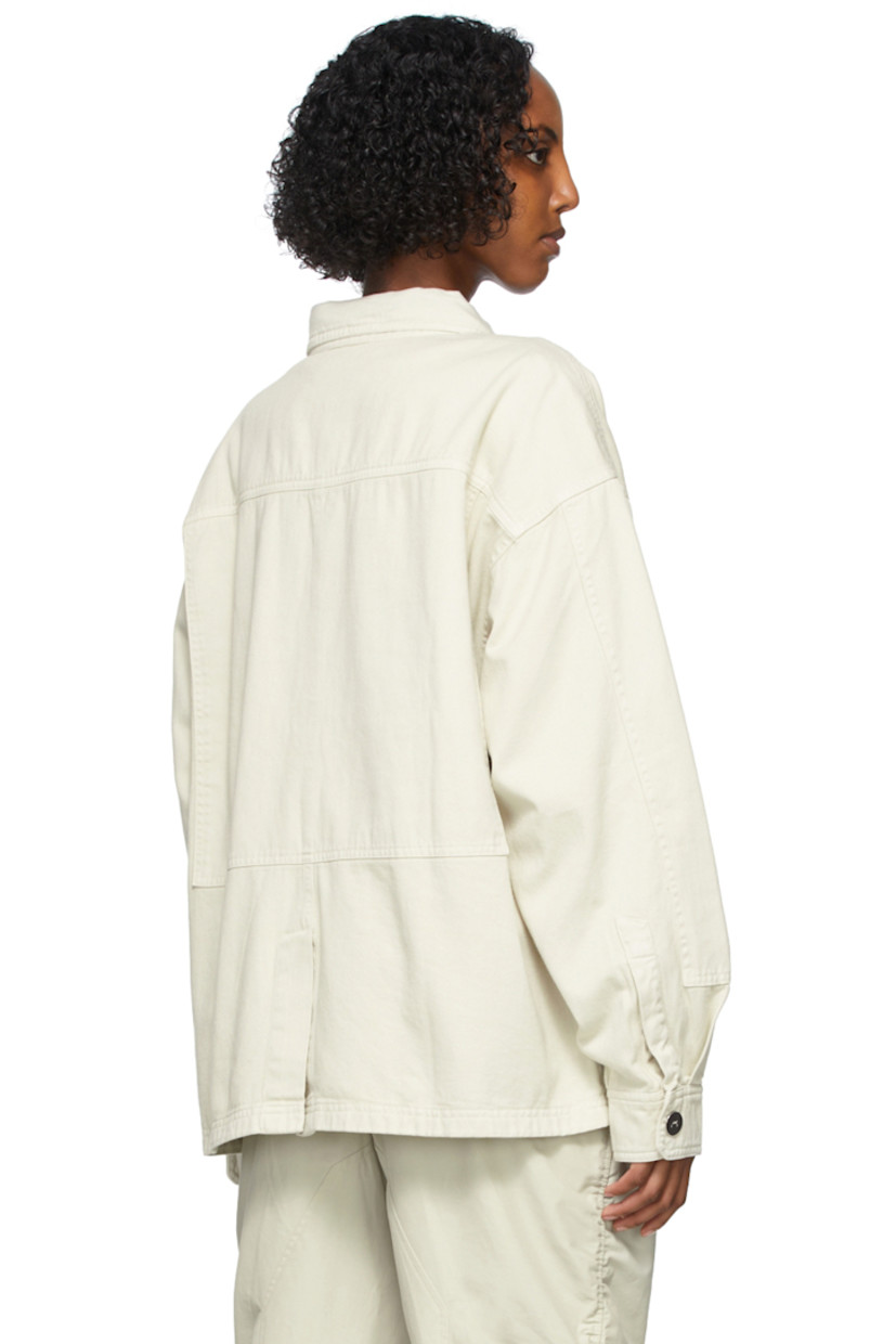 Long sleeve cotton twill jacket in beige. Spread collar. Concealed press-stud closure at front. Flap pockets and tonal embroidered logo at chest. Zippered pockets at waist. Two-button barrel cuffs. Central vent at back hem. Unlined. Logo-engraved silver-tone hardware. 

Supplier color: Bone