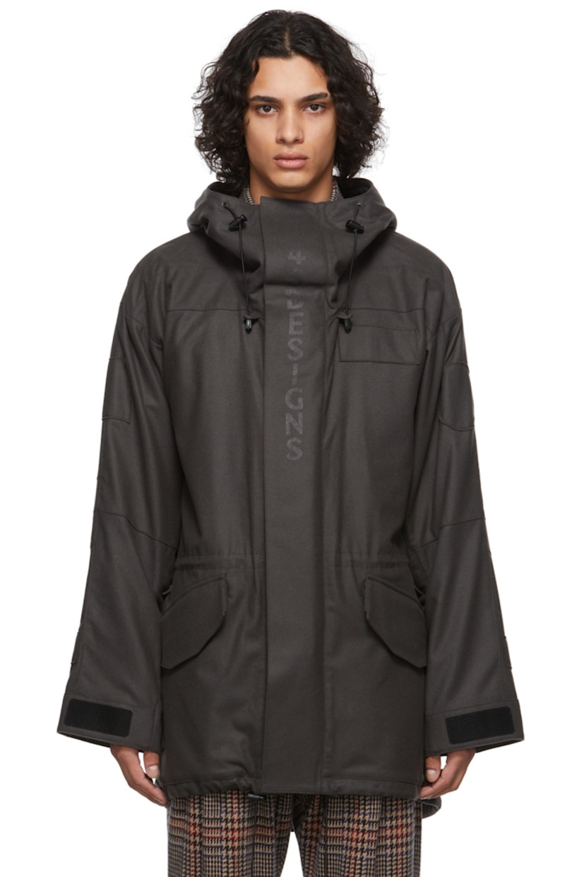 Long sleeve brushed wool, nylon, and cashmere-blend coat in brown featuring tonal logo bonded at front. 

· Velcro closure
· Flap pockets at waist
· Zip vent at sleeves
· Adjustable cuffs 
· Zip pocket at interior
· Fully lined
· Black hardware

Supplier color: Black