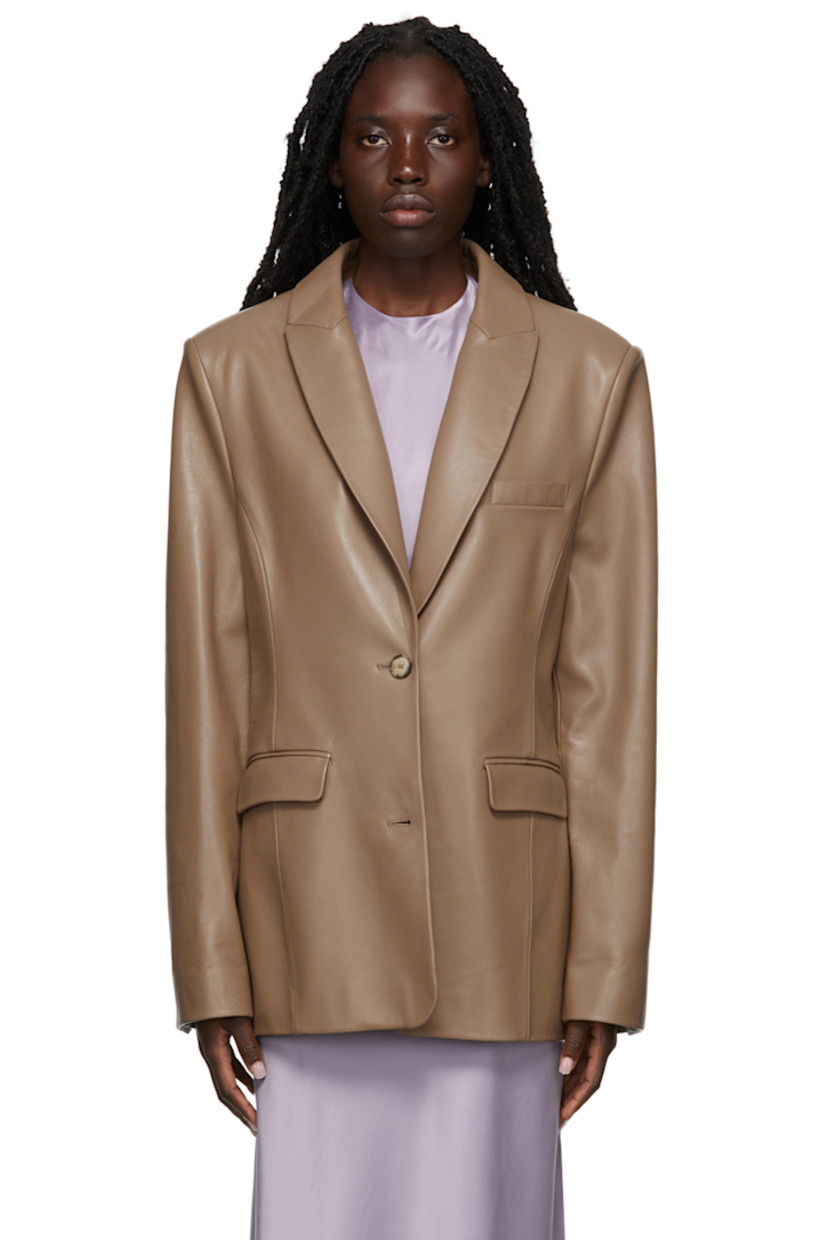 Long sleeve grained lambskin blazer in taupe. 

· Peaked lapel collar
· Two-button closure at front
· Welt pocket at chest
· Flap pockets at waist
· Twin vents at back hem
· Full lining

Supplier color: Taupe