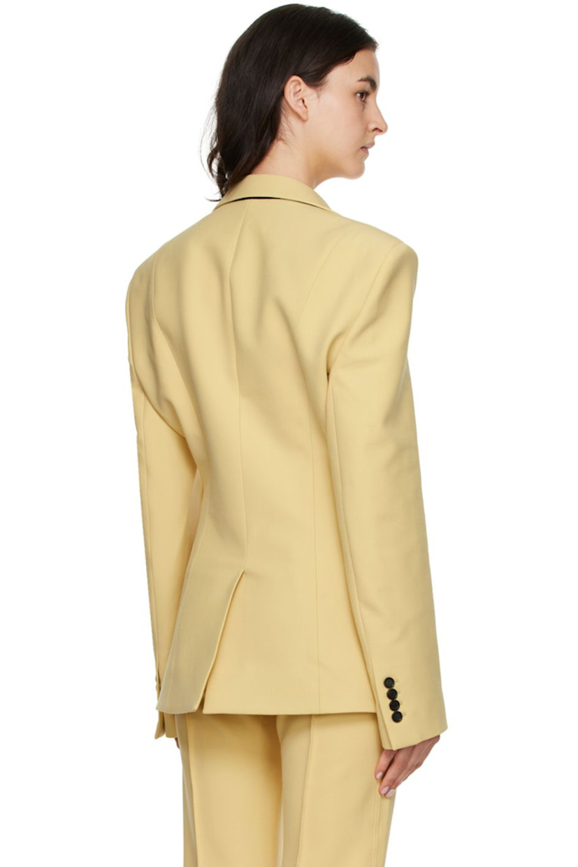 Stretch double-faced woven polyester and virgin wool-blend canvas blazer. 

· Notched lapel 
· Button closure
· Welt pocket and flap pockets 
· Four-button surgeon's cuffs
· Central vent at back hem 
· Fully lined

Available exclusively at SSENSE.

Supplier color: Vanilla