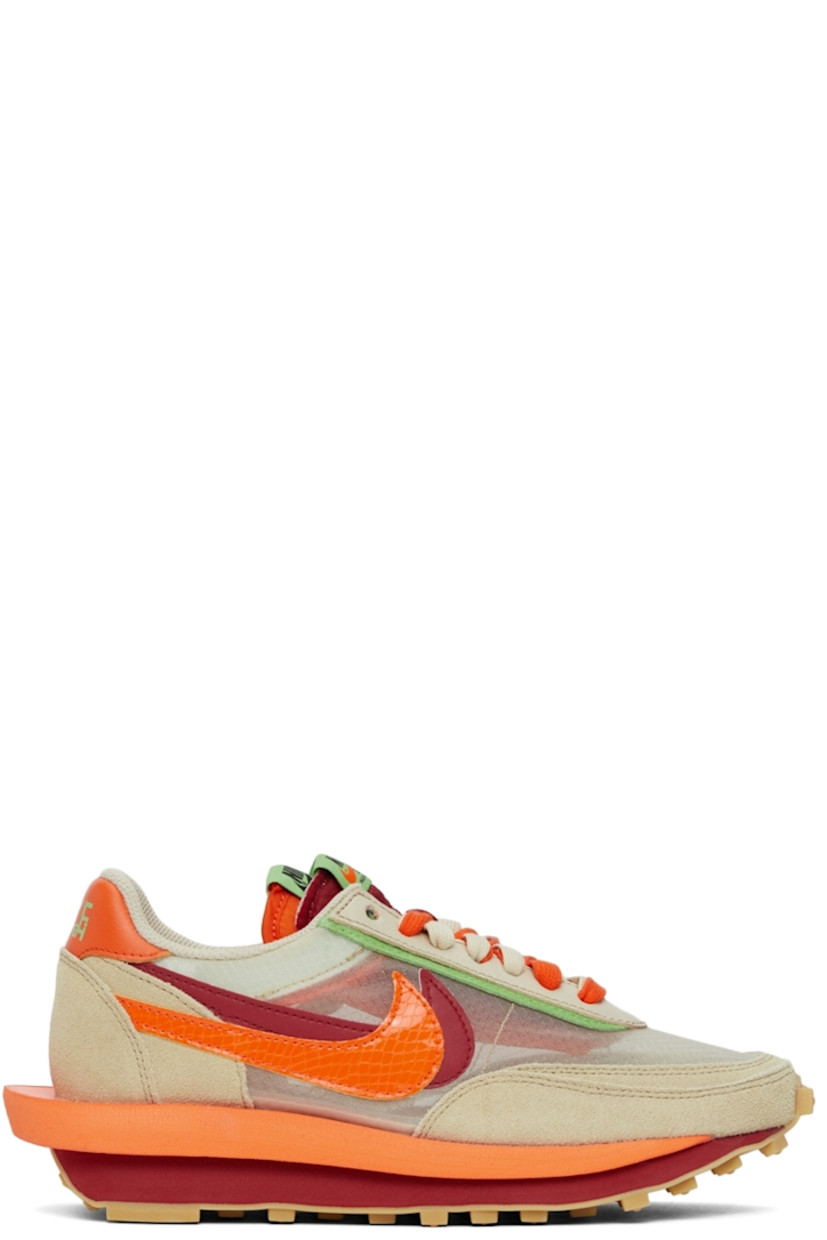 Low-top paneled transparent ripstop and suede sneakers in beige. Round toe. Double lace-up closure in grey and orange featuring buffed leather trim in green at eyerows. Twin padded tongues in orange and red. Padded collar. Signature Swoosh at sides. Logo printed in green at orange buffed leather heel tab. Sculptural foam rubber midsole. Tonal waffle treaded rubber outsole. 

Part of the Nike x sacai x CLOT collaboration. 

Supplier color: Net/Orange blaze