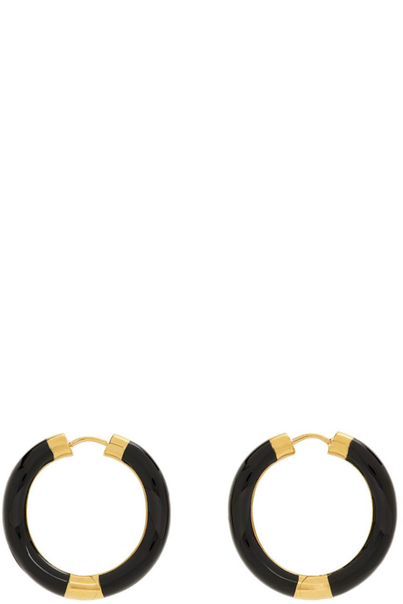 Pair of sculptural earrings in gold vermeil and black enamel. 

· Hinged-post fastening
· H1 x W1 in

Supplier color: Black