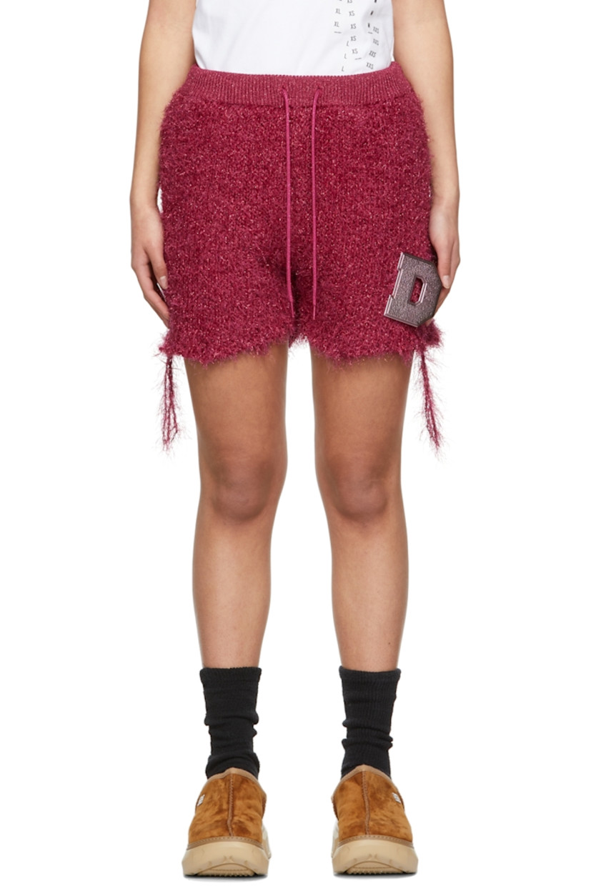 Knit technical nylon shorts in pink featuring metallic thread detailing throughout.

· High-rise
· Three-pocket styling
· Drawstring at elasticized waistband
· Detachable logo pin hardware in pink at front 
· Distressing at hem

Supplier color: Pink