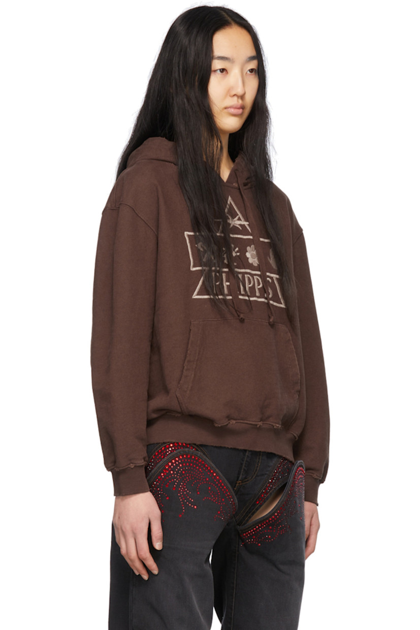Garment-dyed organic cotton French terry hoodie. Distressing throughout. 

· Drawstring at hood
· Logo graphic embroidered at front
· Dropped shoulders
· Kangaroo pocket
· Rib knit cuffs and hem

Supplier color: Brown