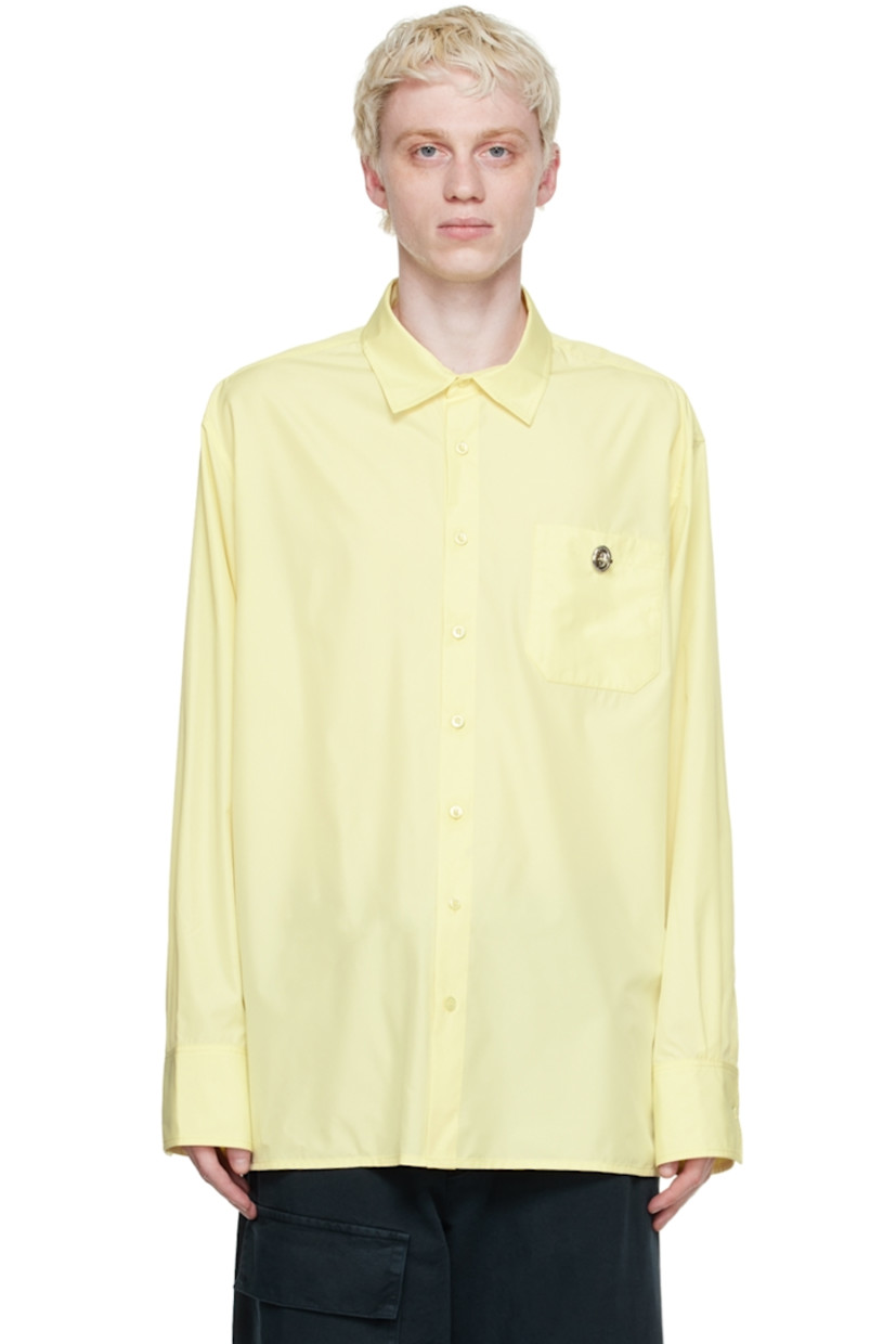 Recycled polyester satin shirt. 

· Spread collar
· Button closure 
· Patch pocket with turn-lock fastening
· Box pleat at back yoke
· Single-button barrel cuffs

Supplier color: Soft yellow parley