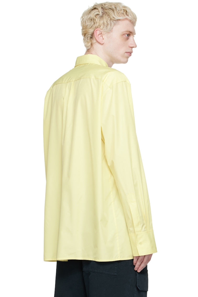 Recycled polyester satin shirt. 

· Spread collar
· Button closure 
· Patch pocket with turn-lock fastening
· Box pleat at back yoke
· Single-button barrel cuffs

Supplier color: Soft yellow parley