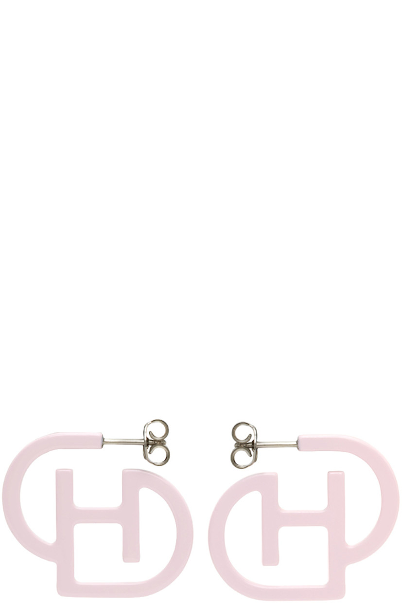 Pair of sculptural hoop earrings in pink sterling silver. Logo cut-out at length.

· Post-stud fastening
·� H1.25 x W1.5 in

Supplier color: Pink
