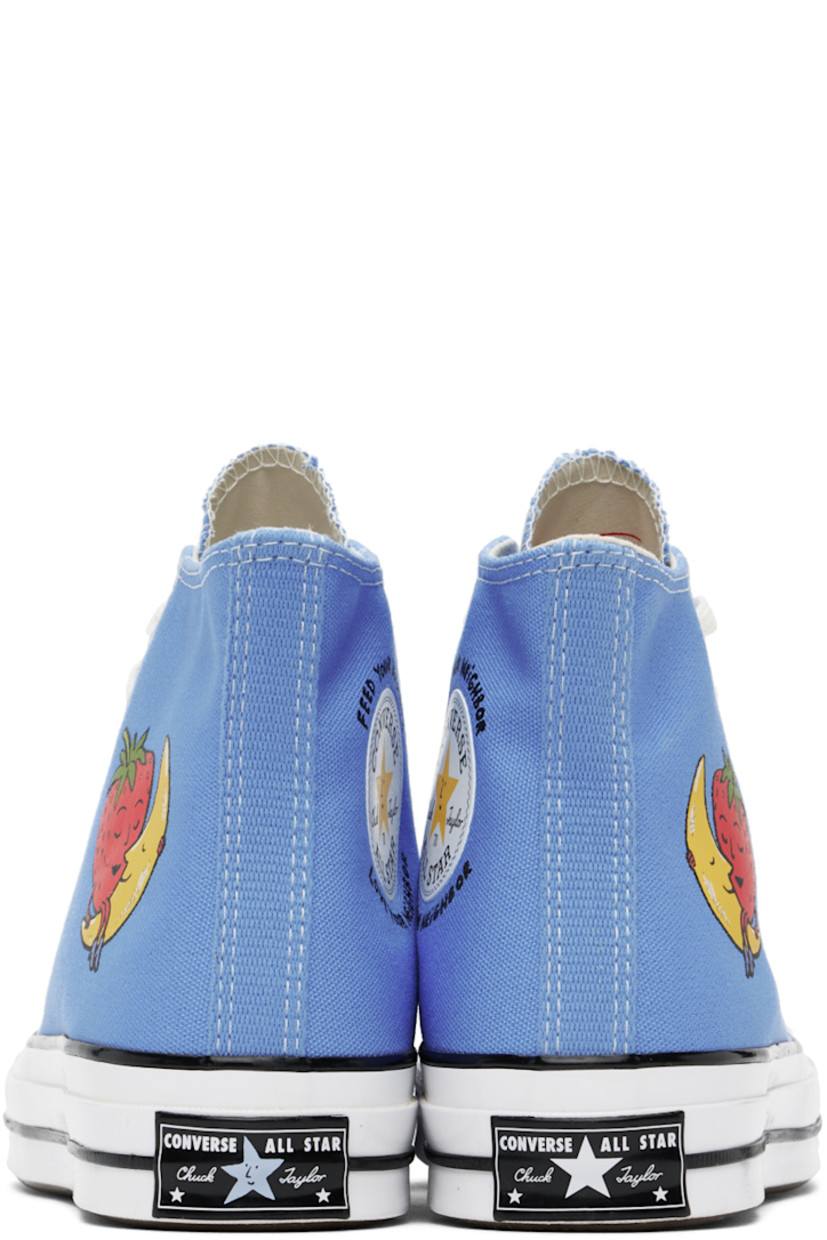 High-top 12 oz cotton canvas sneakers in blue. 

· Rubber cap toe 
· Lace-up closure
· Logo patch and text bonded at inner side
· Graphic bonded at outer side
· Twill lining
· Logo patch at rubber midsole
· Treaded rubber sole 

Part of the Sky High Farm Workwear x Converse collaboration.

Supplier color: University blue/Multi/White