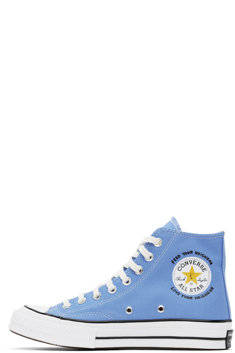 High-top 12 oz cotton canvas sneakers in blue. 

· Rubber cap toe 
· Lace-up closure
· Logo patch and text bonded at inner side
· Graphic bonded at outer side
· Twill lining
· Logo patch at rubber midsole
· Treaded rubber sole 

Part of the Sky High Farm Workwear x Converse collaboration.

Supplier color: University blue/Multi/White