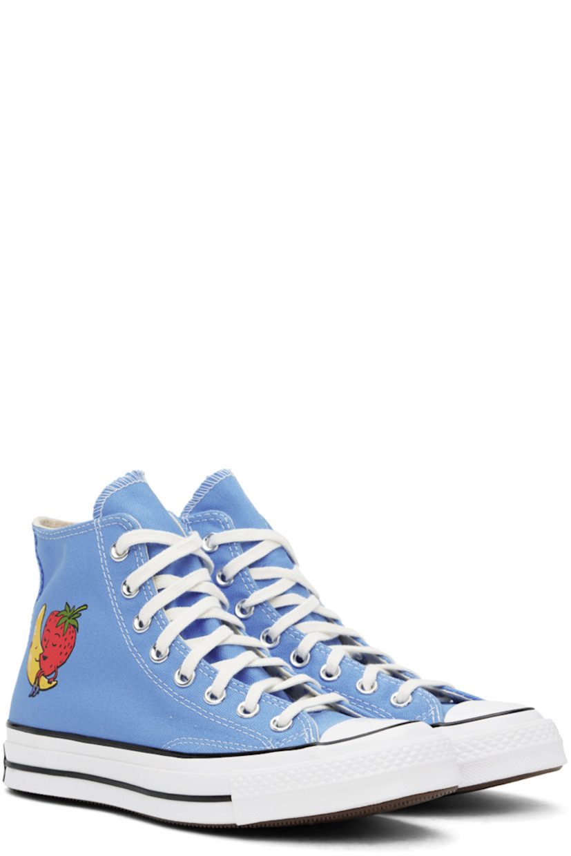 High-top 12 oz cotton canvas sneakers in blue. 

· Rubber cap toe 
· Lace-up closure
· Logo patch and text bonded at inner side
· Graphic bonded at outer side
· Twill lining
· Logo patch at rubber midsole
· Treaded rubber sole 

Part of the Sky High Farm Workwear x Converse collaboration.

Supplier color: University blue/Multi/White