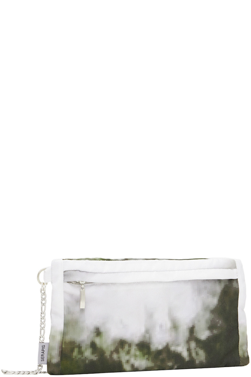 Twill messenger bag featuring graphic pattern printed in tones of green and off-white.

· Adjustable figaro chain shoulder strap
· Zip pocket at face and back face
· Satin lining in gray
· H5.5 x W10.75 in

Part of the Let The Sea Resound, And All That Is In It: Part 2 (Hippocampus) collection.

Available exclusively at SSENSE.

Supplier color: Hull moss