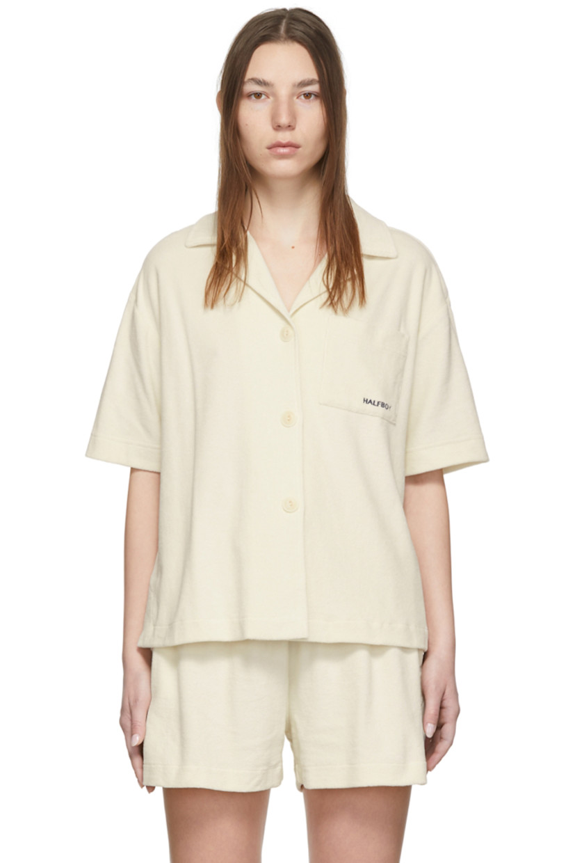 Short sleeve cotton and nylon-blend terrycloth shirt in off-white. Logo embroidered in navy at front. 

· Open spread collar
· Button closure
· Patch pocket at chest
· Vented side-seams

Supplier color: Cream