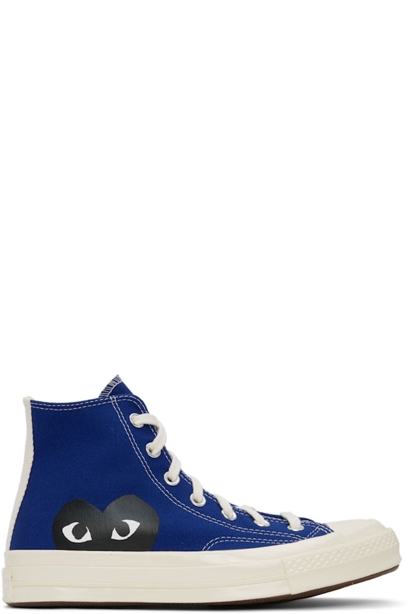 High-top canvas sneakers in blue featuring logo graphic bonded in black at outer side.

· Lace-up closure 
· Webbing trim at heel
· Rubber sole
· Silver-tone hardware

Part of the Comme des Garçons Play x Converse collaboration.

Supplier color: Blue quartz/Egret/Black
