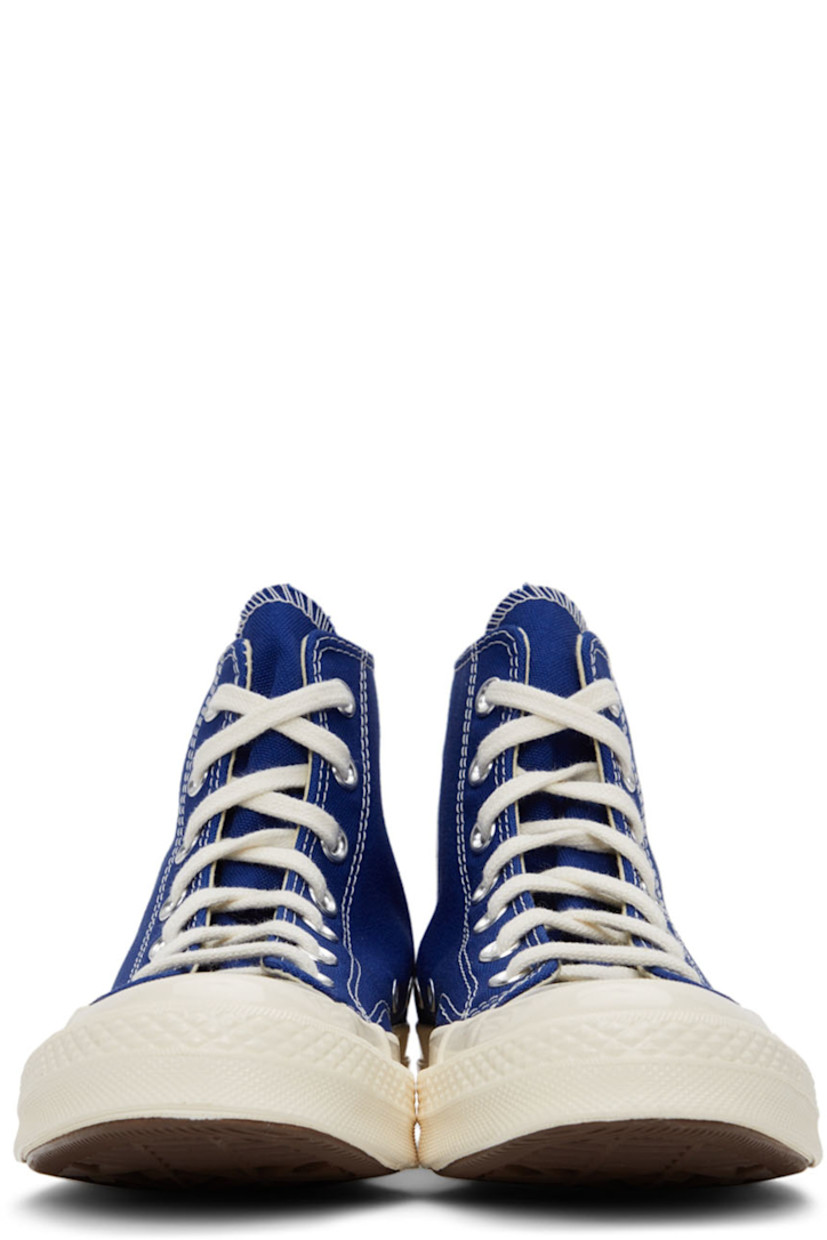 High-top canvas sneakers in blue featuring logo graphic bonded in black at outer side.

· Lace-up closure 
· Webbing trim at heel
· Rubber sole
· Silver-tone hardware

Part of the Comme des Garçons Play x Converse collaboration.

Supplier color: Blue quartz/Egret/Black