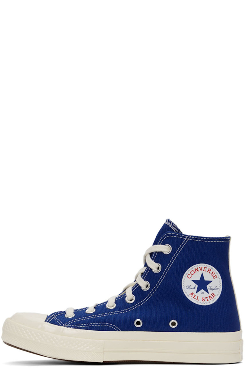 High-top canvas sneakers in blue featuring logo graphic bonded in black at outer side.

· Lace-up closure 
· Webbing trim at heel
· Rubber sole
· Silver-tone hardware

Part of the Comme des Garçons Play x Converse collaboration.

Supplier color: Blue quartz/Egret/Black