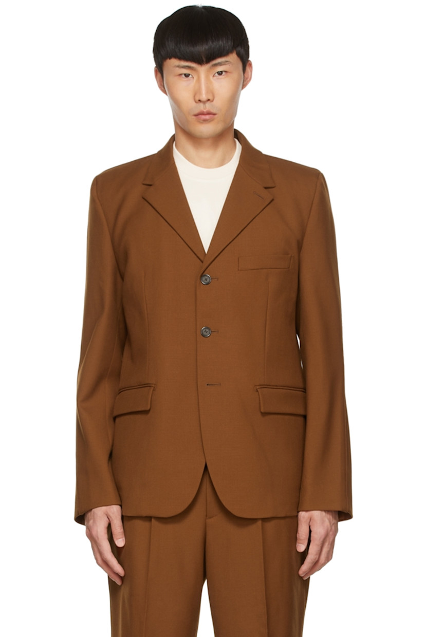Stretch wool twill blazer. 

· Notched lapel
· Button closure
· Mock pockets
· Vents at back hem
· Full satin lining

Supplier color: Brown