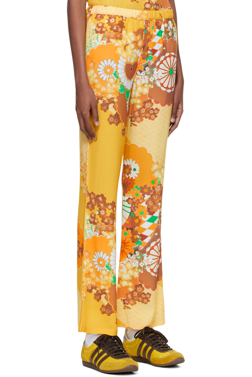 Viscose-blend crepe lounge pants. Graphic pattern printed throughout.

· Elasticized waistband
· Metallic thread topstitching at outseams

Supplier color: Yellow