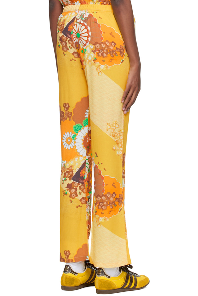 Viscose-blend crepe lounge pants. Graphic pattern printed throughout.

· Elasticized waistband
· Metallic thread topstitching at outseams

Supplier color: Yellow