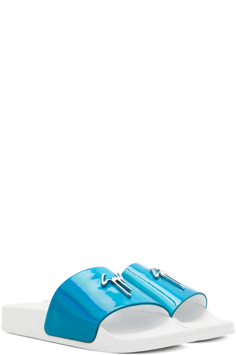 Iridescent textile slip-on sandals in blue.

· Open round toe
· Strap with logo hardware at vamp
· Logo embossed at textured rubber footbed
· Buffed leather lining
· Treaded rubber sole in white

Supplier color: Turquoise