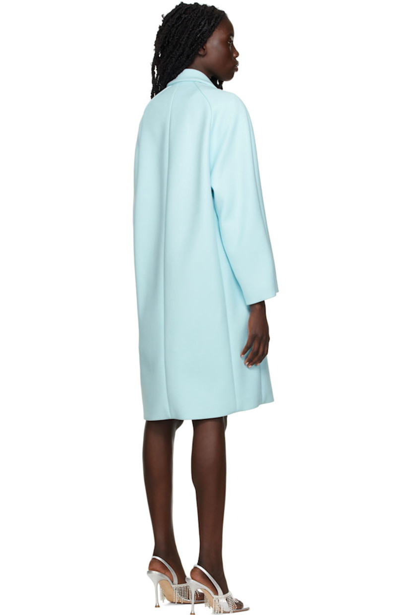 Long sleeve stretch viscose and nylon-blend twill coat in blue.

· Notched lapel collar
· Double-breasted button closure
· Welt pockets at waist
· Crystal-cut logo appliqué at back collar
· Unlined

Supplier color: Blue