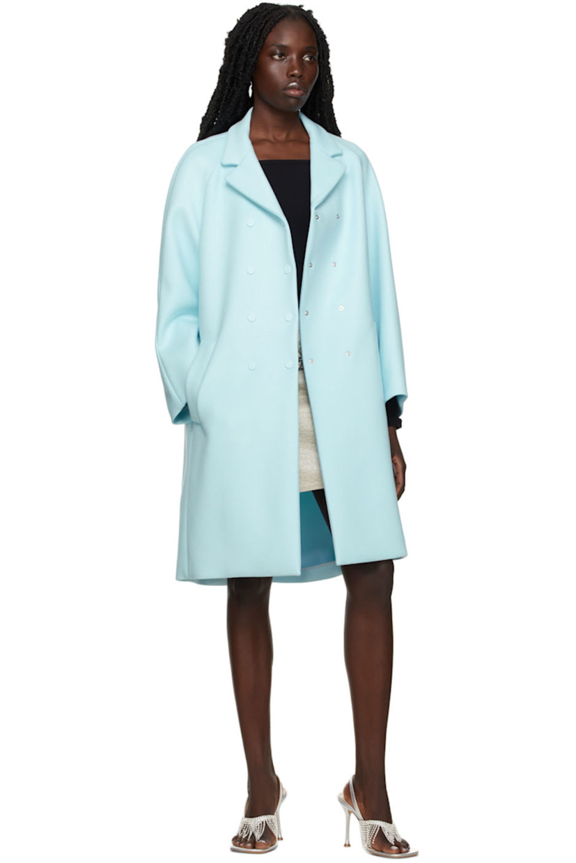 Long sleeve stretch viscose and nylon-blend twill coat in blue.

· Notched lapel collar
· Double-breasted button closure
· Welt pockets at waist
· Crystal-cut logo appliqué at back collar
· Unlined

Supplier color: Blue