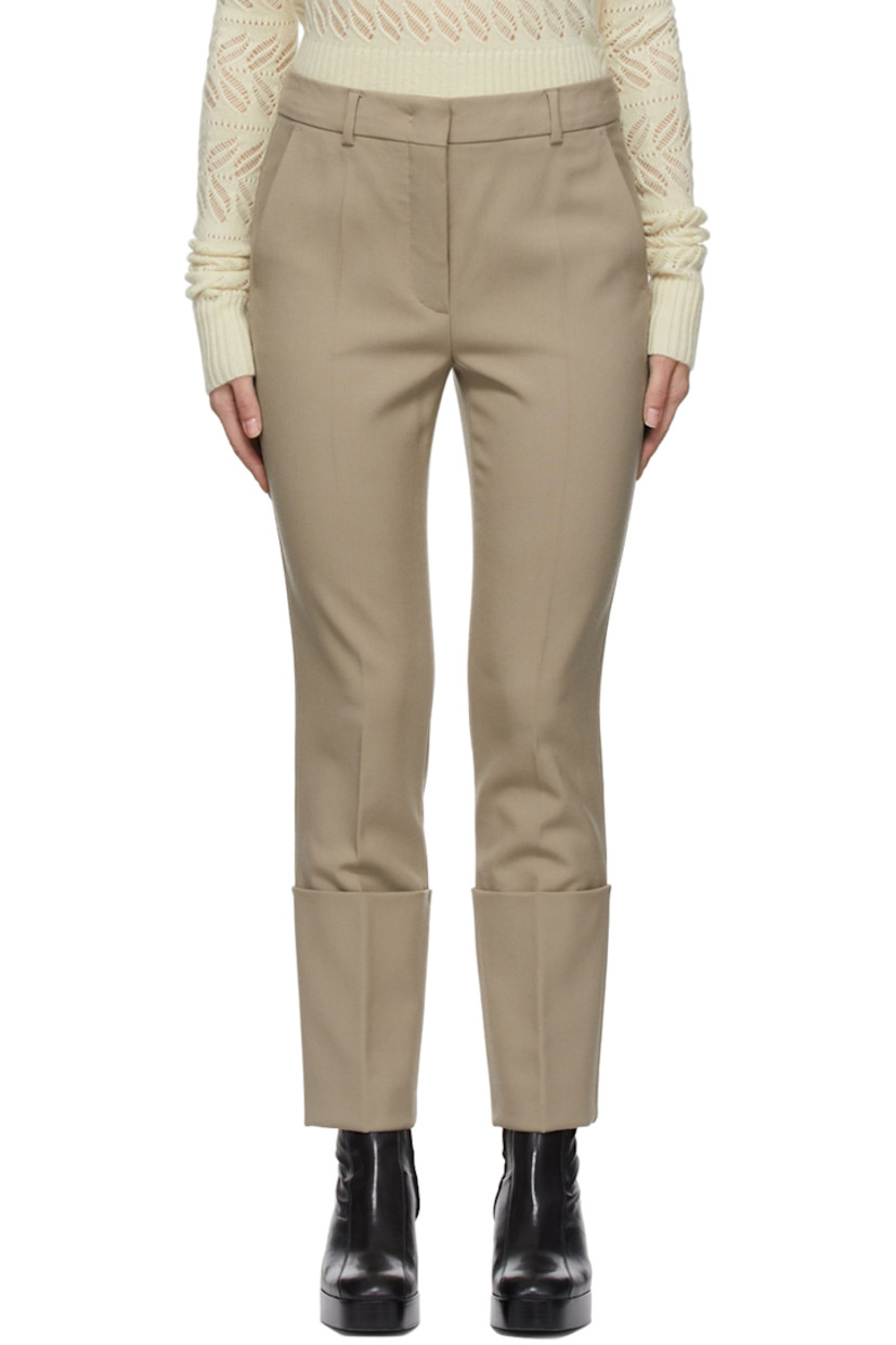 Straight-leg plain woven wool trousers in beige.

· Mid-rise
· Four-pocket styling
· Belt loops at waistband
· Cuffed hem

Supplier color: Dry everblack