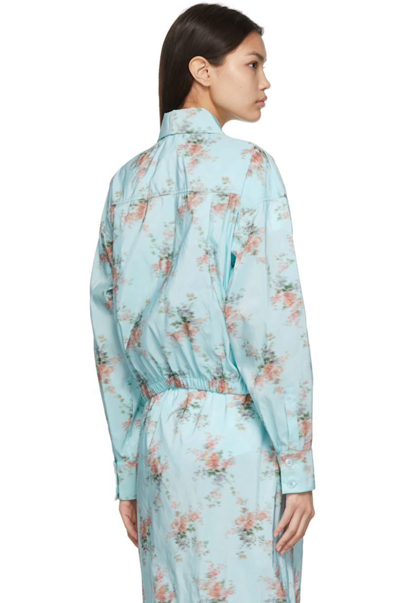 Long sleeve nylon-blend taffeta shirt in blue featuring floral pattern in multicolor. 

· Spread collar
· Concealed button closure
· Pockets at waist
· Two-button barrel cuffs
· Signature crystal-cut detailing at cuff
· Gathering at elasticized hem
· Pleats at back yoke
· Mother-of-pearl hardware

Supplier color: Light blue