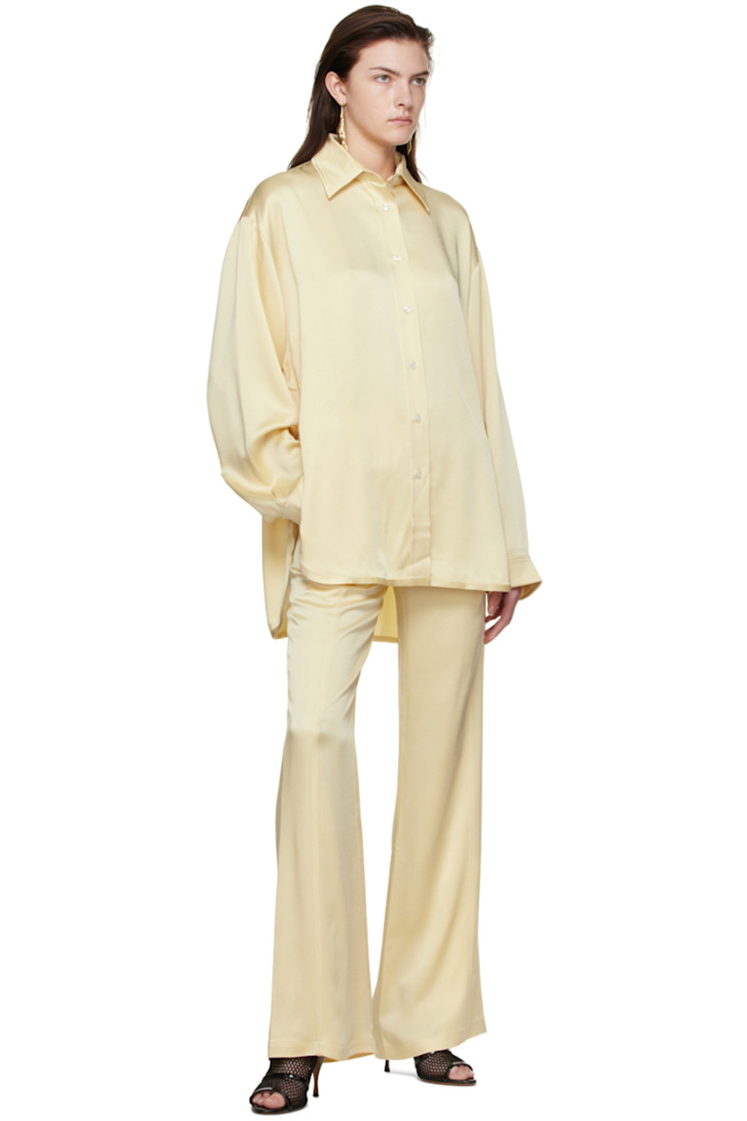 Acetate and viscose-blend satin shirt.

· Spread collar
· Button closure
· Vented side-seams
· Logo embroidered at cuff
· Single-button barrel cuffs
· Shirttail hem

Supplier color: Cream