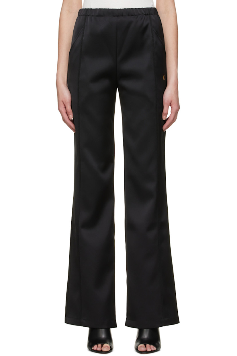 Polyester bonded satin trousers.

· Elasticized waistband
· Logo embroidered at front
· Exposed seam at front legs
· Two-pocket styling

Supplier color: Black
