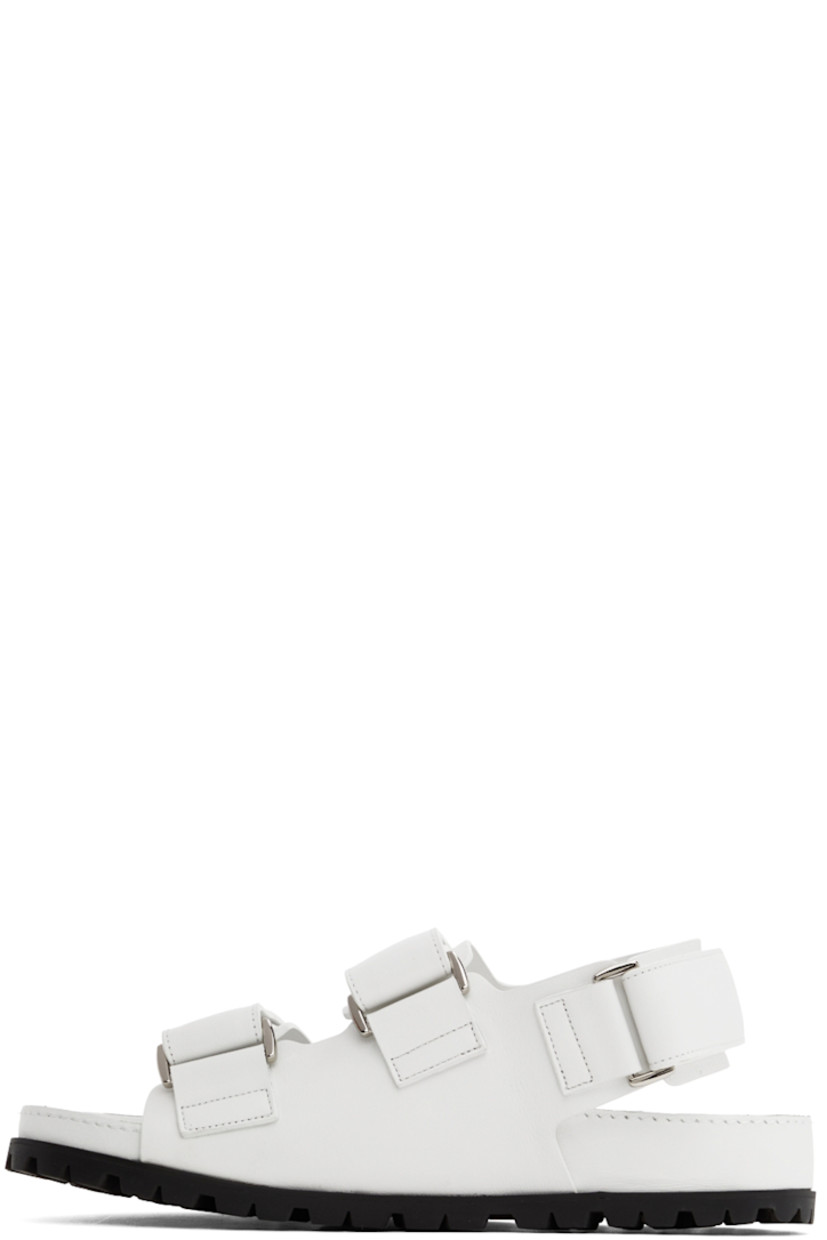 Buffed leather sandals in white. 

· Open round toe
· Velcro straps and logo hardware at vamp
· Velcro slingback strap
· Logo-embossed leather patch at molded leather footbed
· Treaded rubber sole

Supplier color: White