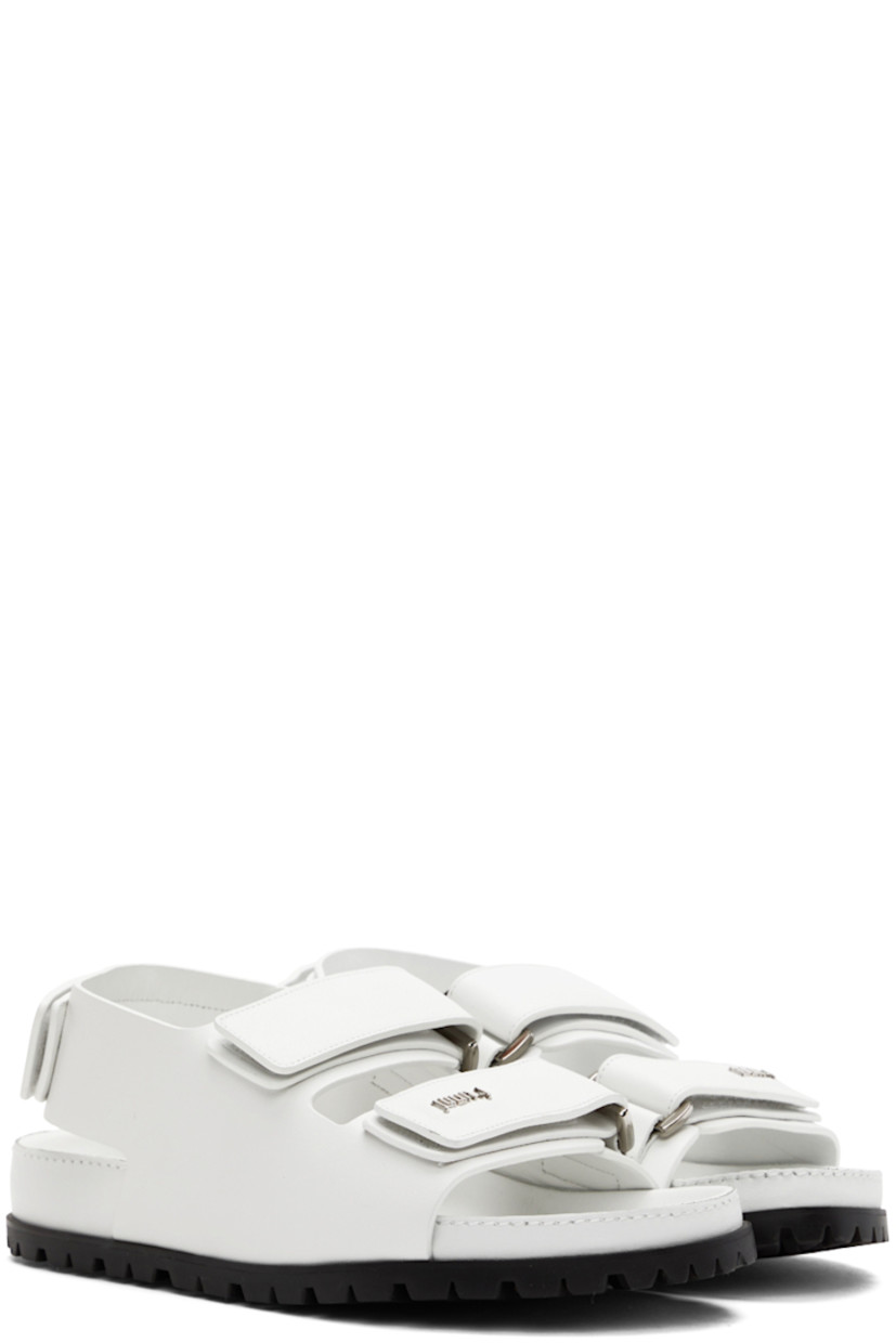 Buffed leather sandals in white. 

· Open round toe
· Velcro straps and logo hardware at vamp
· Velcro slingback strap
· Logo-embossed leather patch at molded leather footbed
· Treaded rubber sole

Supplier color: White