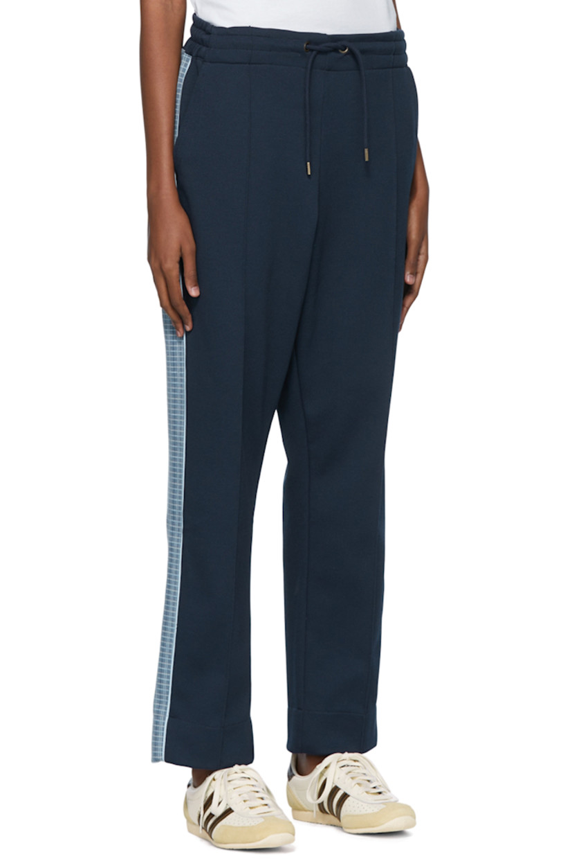 Cotton-blend jersey lounge pants.

· Drawstring at elasticized waistband
· Piping at front 
· Knit trim at sides
· Logo embroidered at back pocket
· Three-pocket styling

Supplier color: Navy