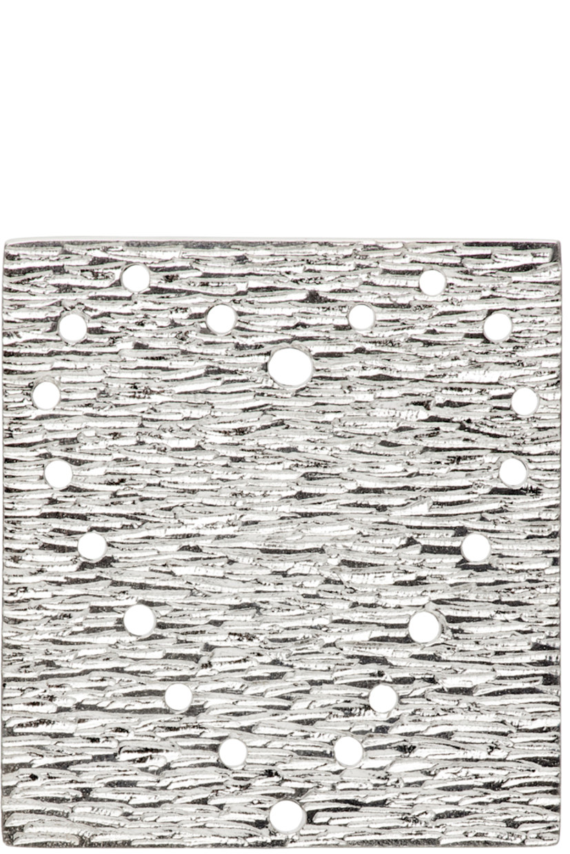Single sterling silver button-style brooch.

· Textured detailing and graphic button holes at face
· Full hallmark engraving at back face
· Thread included
· H1.5 x W1.5 in

Available exclusively at SSENSE.

Supplier color: Silver