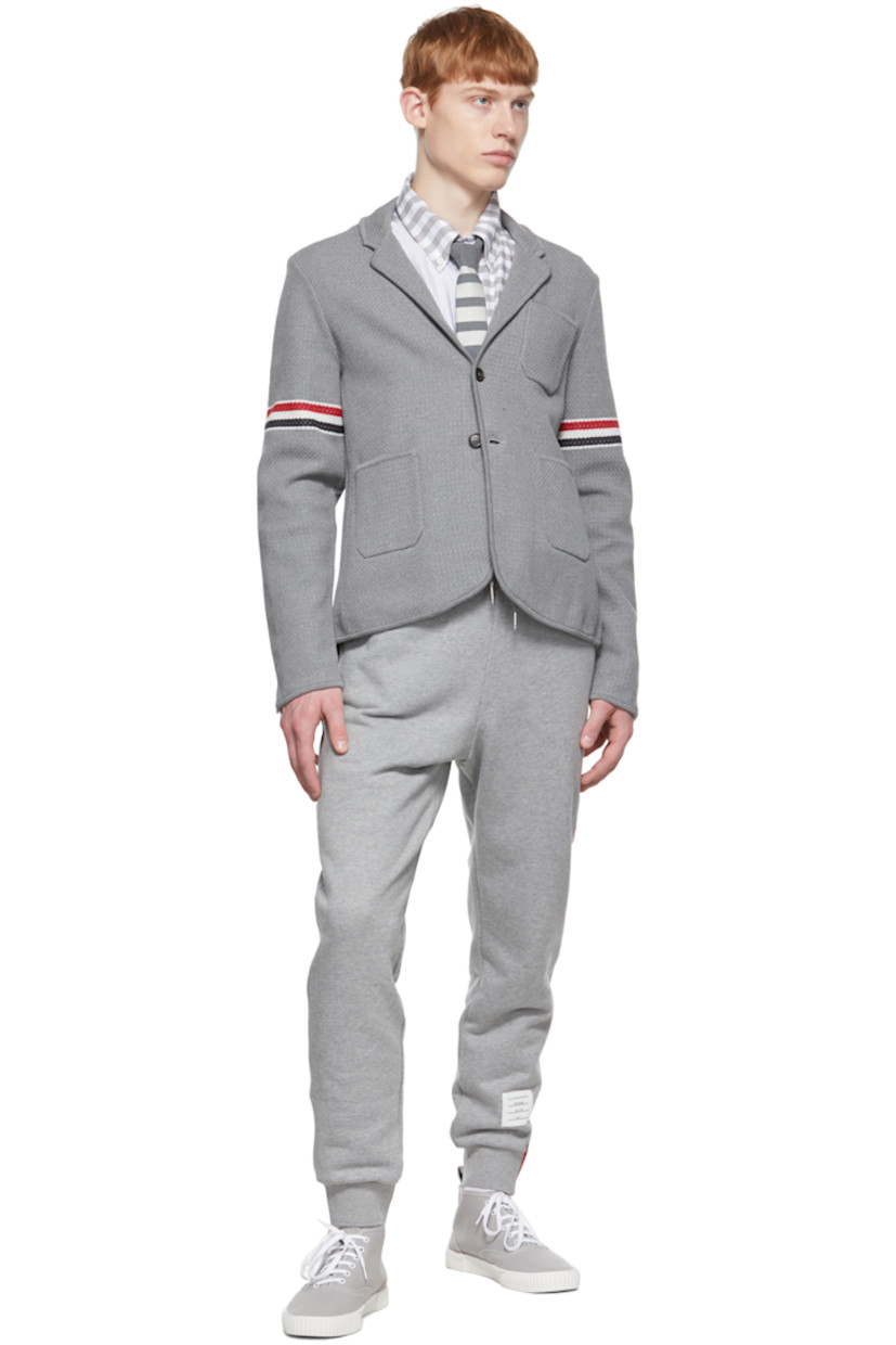 Long sleeve stretch textured knit cotton and wool-blend blazer in grey.

· Notched lapel collar
· Two-button closure at front
· Patch pockets at chest and waist
· Jacquard knit signature tricolor stripes at sleeve
· Four-button surgeon's cuffs with signature tricolor grosgrain trim
· Signature tricolor grosgrain flag at back collar
· Twin vents at back hem
· Detachable signature tricolor grosgrain strap at interior

Supplier color: Light grey