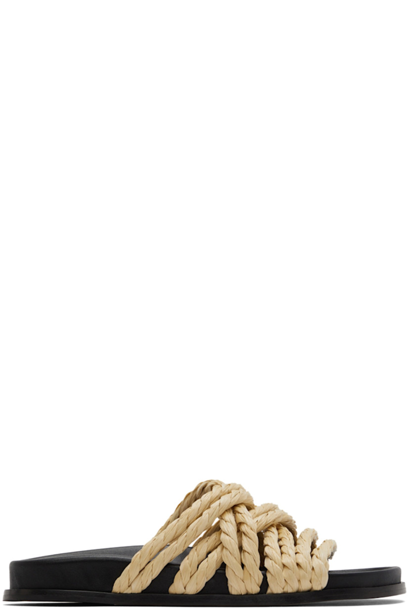 Woven raffia sandals in beige.

· Criss-crossing straps at vamp
· Logo patch at molded leather footbed
· Stacked leather outsole

Supplier color: Raffia