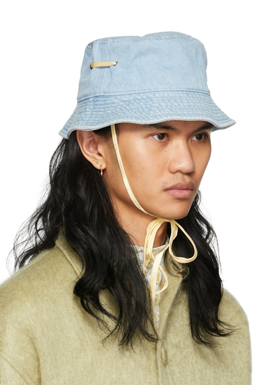 Non-stretch denim bucket hat in blue. 

· Quilted brim 
· Eyelets at crown
· Silk self-tie chin strap 

Supplier color: Vintage wash